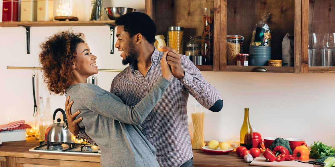 Photo of couple dancing in kitchen