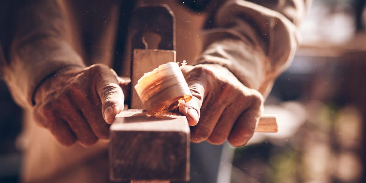 Photo of a man woodworking